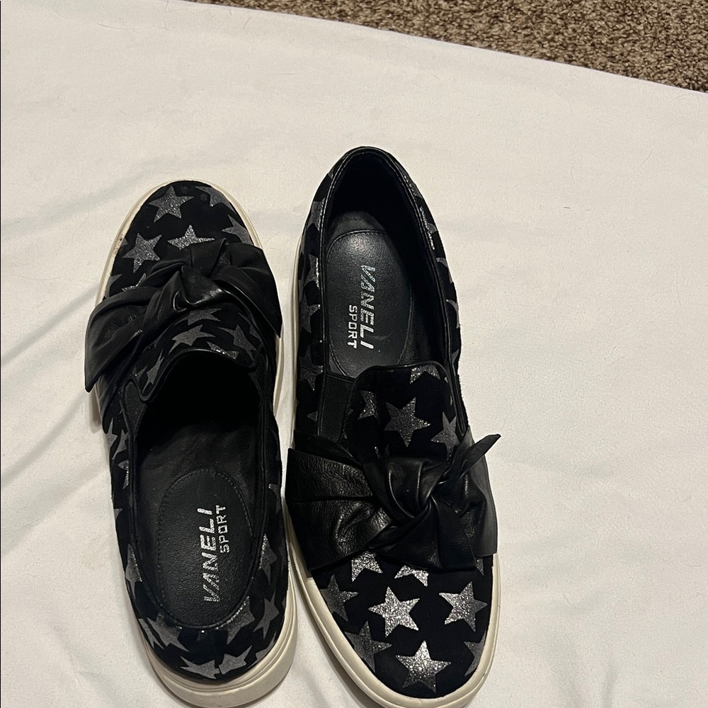Vaneli sport black suede sneakers with silver stars and bow detail